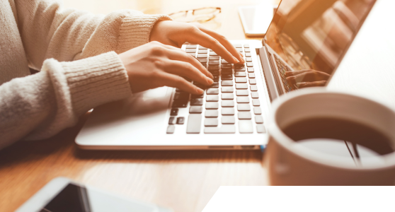 A woman typing on the computer